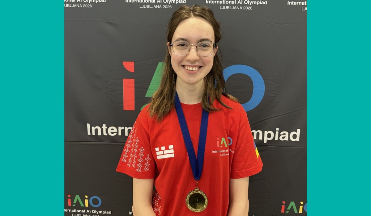 Stephen Perse Cambridge student Kseniia S smiles and proudly displays her gold AI Olympiad medal